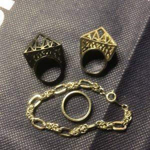 Multiple rings and bracelet in silver tone